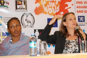 Executive director Center for Domestic violence Prevention,Tina Musuyu (left) looks on,as United Nations women and the center for domestic violence prevation representative Kathyryn Howard Wilkes presents the report on  recommended sector priorities to improve women's access to justice and eliminate violence against women and girls in Uganda, during the high level forum for judges on justice for women and girls 2018,at Sheraton hotel in Kampala on Thursday 29/11/2018.Photo by Sylvia Katushabe. Executive director Center for Domestic violence Prevention,Tina Musuyu (left) looks on,as United Nations women and the center for domestic violence prevation representative Kathyryn Howard Wilkes presents the report on  recommended sector priorities to improve women's access to justice and eliminate violence against women and girls in Uganda, during the high level forum for judges on justice for women and girls 2018,at Sheraton hotel in Kampala on Thursday 29/11/2018.Photo by Sylvia Katushabe.