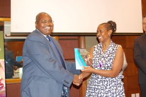 Deputy chief justice hon justice Yorokamu Bamwine receives a report on negotiating gender justice from executive director center for Domestic Violence Prevention Tina Musuya ,during the high level forum for judges on justice for women and girls 2018,at Sheraton hotel in Kampala on Thursday 29/2018.Photo by Sylvia Katushabe. Deputy chief justice hon justice Yorokamu Bamwine receives a report on negotiating gender justice from executive director center for Domestic Violence Prevention Tina Musuya ,during the high level forum for judges on justice for women and girls 2018,at Sheraton hotel in Kampala on Thursday 29/2018.Photo by Sylvia Katushabe.
